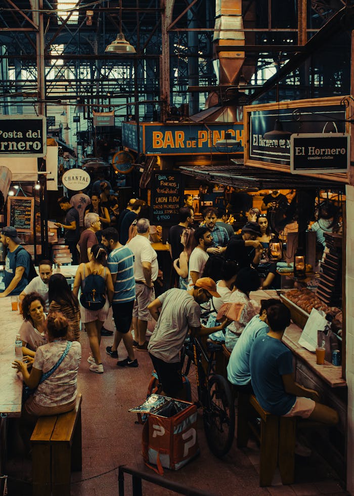 Bustling indoor scene at San Telmo Market, Buenos Aires, showcasing local culture and social interactions.